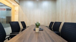 Meeting room with a long table and chairs at Linked Offices, Kolkata